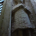 little munden church, herts. interestingly unfinished  weeper on chest tomb of sir john thornbury, +1396 and his wife nanarina. this figure is on the west end, and half hidden by the pier; this may indicate that the tomb was finished in the village, other