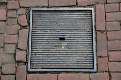Manhole cover of the Koninklijke Nederlandse Grofsmederij
