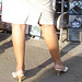 Lady on heels shopping for music CD