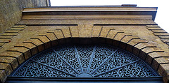 king's cross station, london,cast iron tympanum of the arch originally over the cab entrance to the railway station built 1851-2 by lewis cubitt