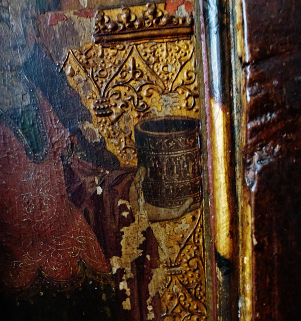 yaxley church, suffolk,detail of the raised gilded gesso background of one of the c16 screen panels, with incised patterns on the clothing too.