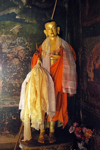 Buddha statue against 14 Century frescoes