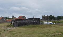 Upturned Keelboat and Lindisfarne Priory