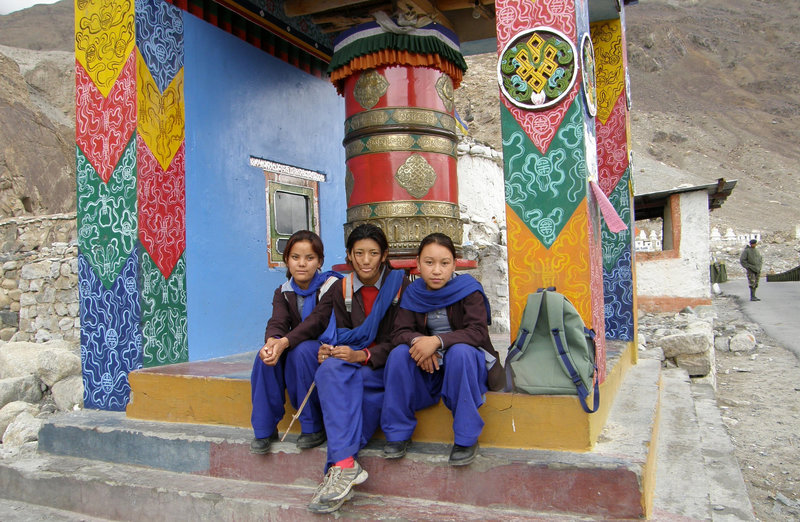 Schoolgirls and prayer wheel