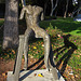 Great L.A. Walk (1508) Sitting Figure On A Short Bench by Magdalena Abakonowicz.
