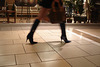 Asian Booty shopping in high-heeled boots / Jeune Dame Asiatique en bottes à talons aiguilles au centre commercial.