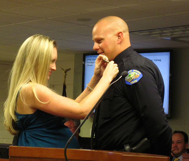 Officer Greg Blum pinned by his wife (1865)