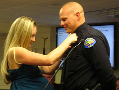Officer Greg Blum pinned by his wife (1866)