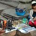 Young souvenir vendor inside Ta Prohm