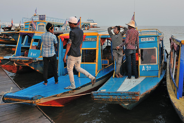 Skippers waiting at the pier while tourist are shopping