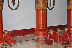 Young monks resting on the floor