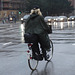 Blonde booty biker in the rain / Cycliste blonde en bottes sous la pluie