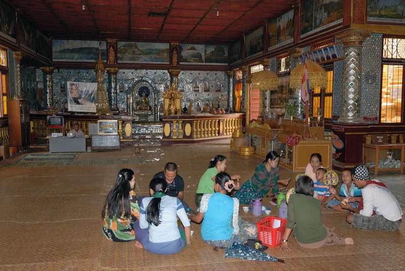 Burmese family enjoy a lunch pick nick on the floor