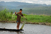 Fisherman throws out the net