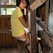 Girl on the weaving loom
