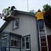 Replacing some of the woodwork on  the house in Askersund in pouring rain
