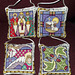 four ornaments depicting carols