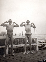 2 bodybuilders on a jetty, 1920'