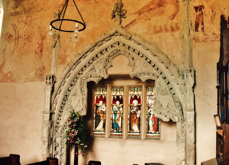 belchamp walter church, essex, john boutetort, c14 tomb canopy with square cut hole to cusps in line with tudor window. contemporary paintings cover the walls.c.1325