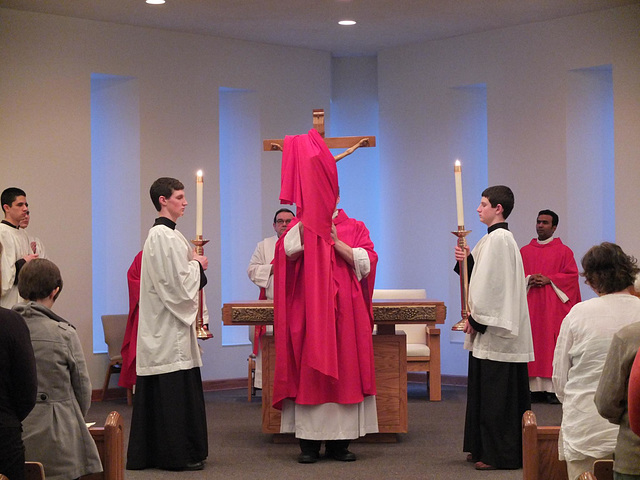 Slowly, and with prayer, the Cross is revealed