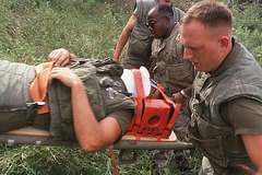 Carrying him to the field ambulance