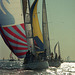 The big, colorful sail is called the spinnaker