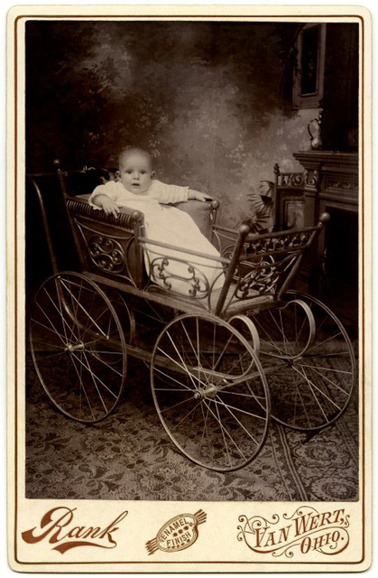 Startled Baby in Ornate Carriage