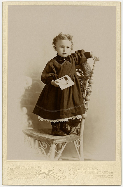 Girl Holding Photograph