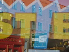 Camden Town reflected in Woolies sale window