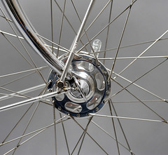 Chrome blade ends, Campagnolo drop outs, and Campagnolo Record large flange hubs tied and soldered to 700c rims.