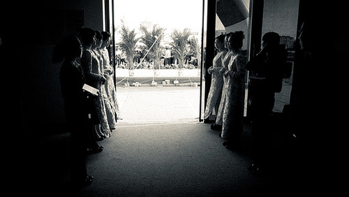 Welcome by a Qipao dressed girls