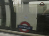 Aldwych sign reflected in tube train