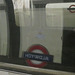 Aldwych sign reflected in tube train