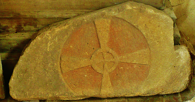 holy trinity, bottisham,large cross relief, with original colour, most probably an early c12 tympanum from over a norman doorway. it is now in the collection of unusual carved stones in the north aisl