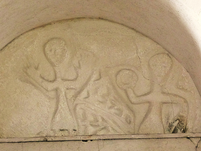 wordwell church, suff.c1100 north doorway tympanum, possibly showing orans figure and the raising of the host.