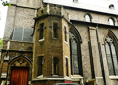 holy trinity church, brompton rd., london,the s.w. porch was added in 1913 by r.w.knightley goddard to the church built in 1826-9 by donaldson, the window tracery having been added by blore in 1843