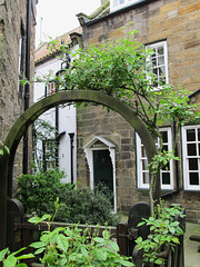 Wesley Cottage, through an arch.