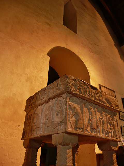 burnham deepdale church, norfolk,the c12 font stands before the c11 saxon tower arch below the triangular headed gallery door