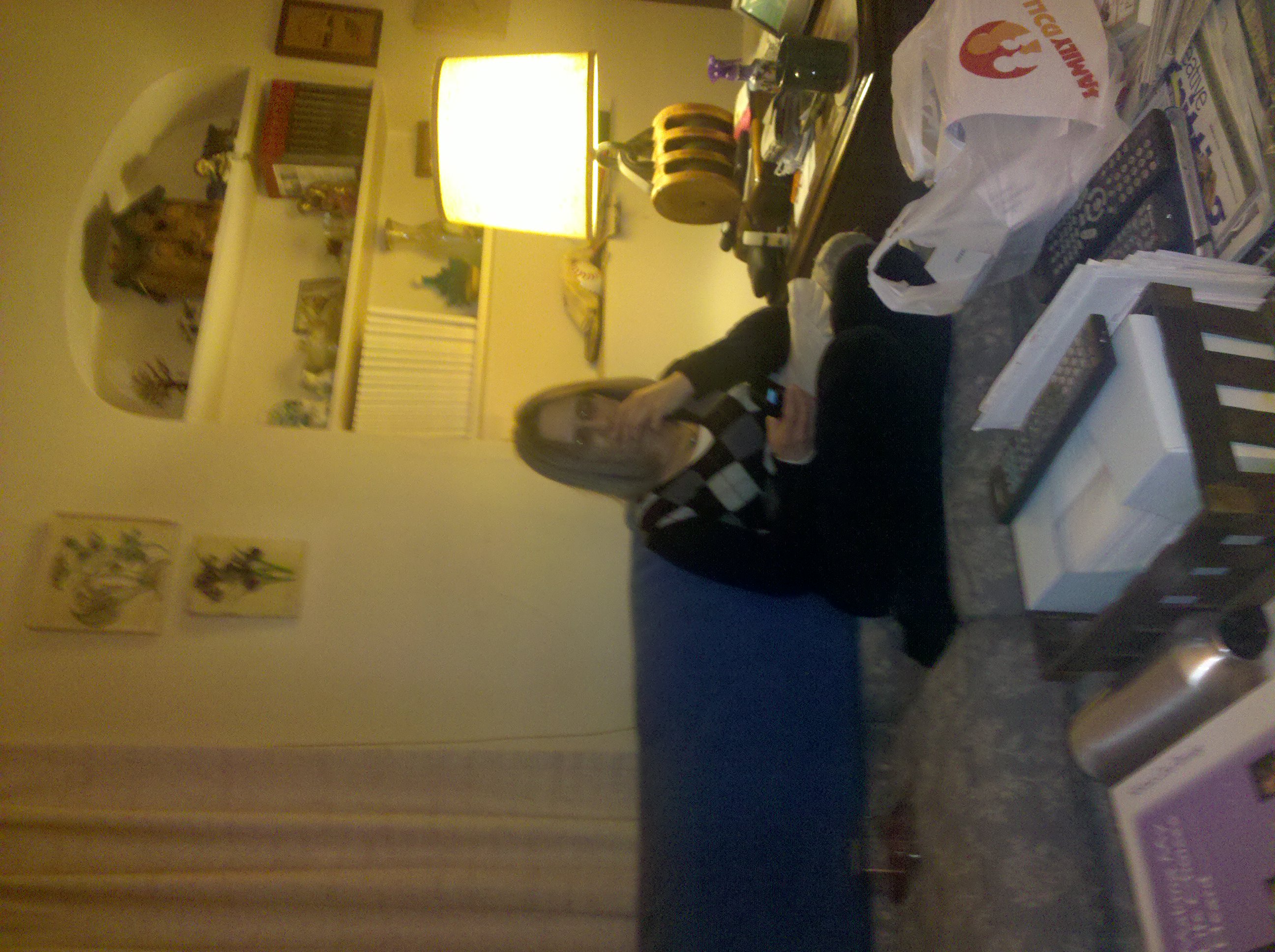 Joan studies her new phone