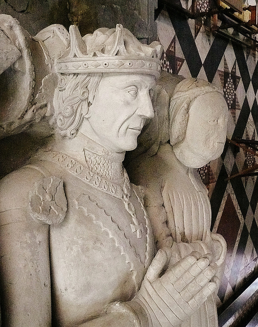 ely cathedral,tomb of john tiptoft, humanist earl of worcester and his two wives philippa and joyce. he died in 1470, beheaded. his over restored effigy sports the ss collar of the lancastrians