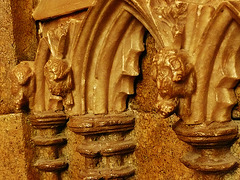 canterbury cathedral,archbishop stratford's tomb of 1348. detail of the alabaster arcade on the tomb chest, with its tiny carved animals .