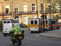 Police vans in front of march Russell Square