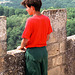 French boy looking at French countryside from a French castle