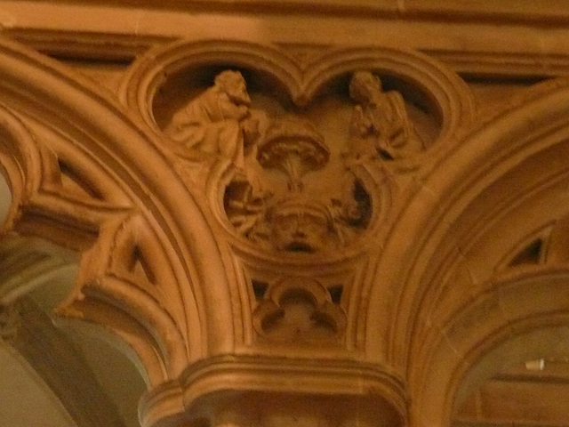 canterbury cathedral, c14detail of monks at lecterns and disputing fill the spandrels of the canopy on the tomb built for archbishop meopham , who died in 1333 makes a screen across the entrance to th