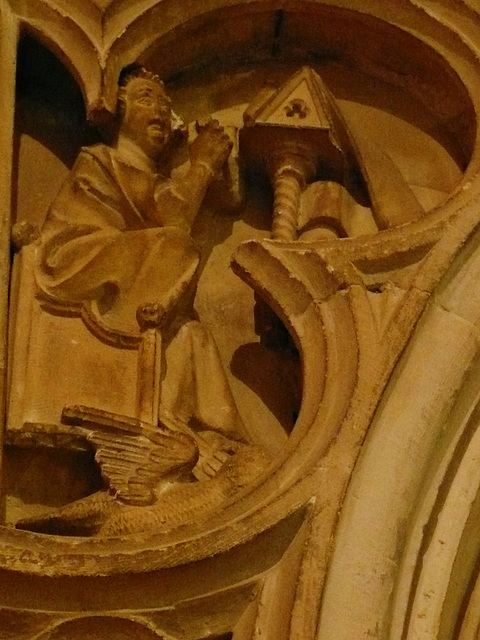 canterbury cathedral,c14 detail of monks at lecterns and disputing fill the spandrels of the canopy on the tomb built for archbishop meopham