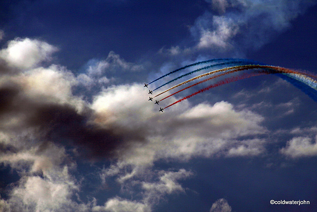 Red Arrows in formation in Moray skies