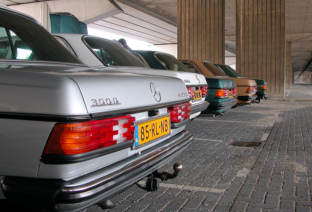 Rear ends of some Mercedes W123s