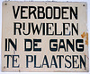Academy Building of Leiden University just before a mayor refurbishment: old sign prohibiting bicycles in the hall
