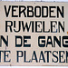 Academy Building of Leiden University just before a mayor refurbishment: old sign prohibiting bicycles in the hall