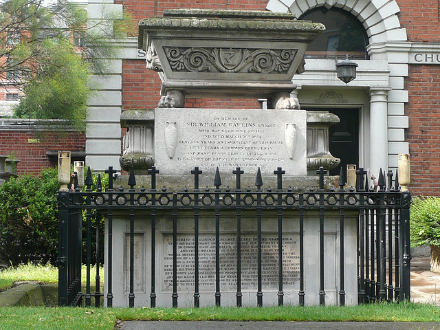 st.botolph bishopsgate, london,the 1838 tomb of william rawlins is in the graveyard of st.botolph bishopsgate next to the 1861 parish hall . sarcophagus with lion's paws.